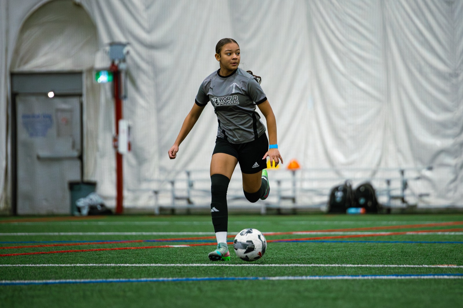 Older 1UP Soccer players in a technical session, attacker vs defender style