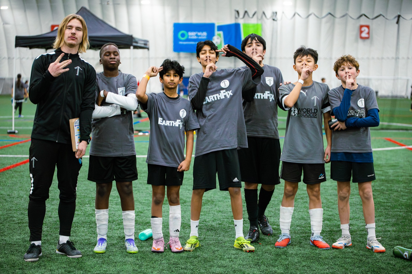 1UP Soccer older players and coach at an indoor facility in Calgary